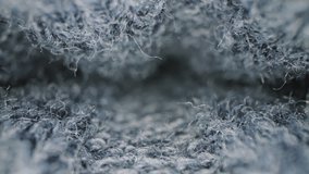 Macro shot of woolen fabric. Slider dolly extreme close-up of clothing material blue fabric texture. Woollens, woolens, wool fibers. Warm winter clothing. Shot with laowa 24mm probe lens - Powered by Shutterstock - Get 15% off with code: PIKWIZARD15