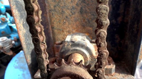 Close-Up Shot Of Old Rusty Moving Chain And Metal Gears Footage.