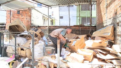 salvador, bahia, brazil - december 9, 2020: worker is seen separating material for recycling in a company in the city of Salvador. 