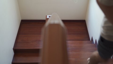 asian man running up stair at home. male hurry going to upper floor at home. active men jogging exercise on staircases at home. 