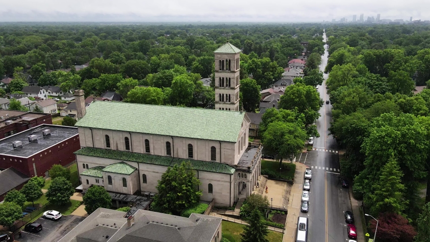 Drone Aerial View of Saint Joan of Arc Church in Indianapolis. Catholic Landmark and Green Surroundings, Indiana USA