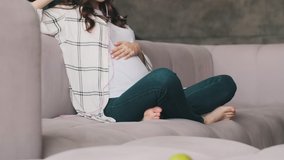 Young pregnant optimistic woman listening music with headphones indoors at home - Powered by Shutterstock - Get 15% off with code: PIKWIZARD15
