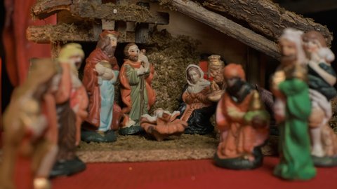 Holy night and Jesus Christ Nativity scene, illuminated Christmas decoration of Jesus birth in the manger with Mary. Religious scene of christmas figurines.