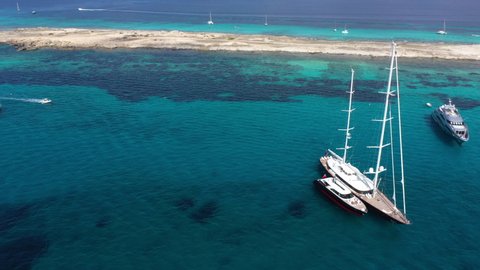 Aerial view of yachts in turquoise water near Formentera. Balearic Islands, Spain