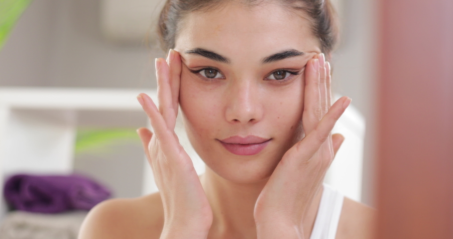 Young woman making cosmetic skin care | Shutterstock HD Video #1063852573