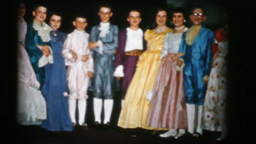TRENTON, NEW JERSEY, DECEMBER, 1956: High school students do their curtain call after successfully performing Cinderella for their audience in 1956.