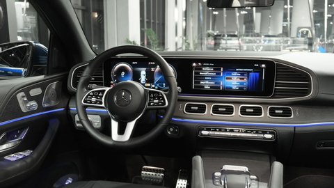 Moscow, Russia - December, 2020: Steering wheel, dashboard and electronic displays in the brand new Mercedes-Benz GLE SUV. Car interior