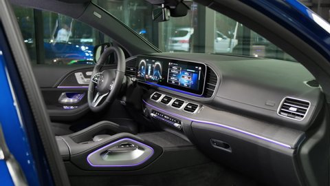 Moscow, Russia - December, 2020: Steering wheel, dashboard and electronic displays in the brand new Mercedes-Benz GLE SUV. Car interior