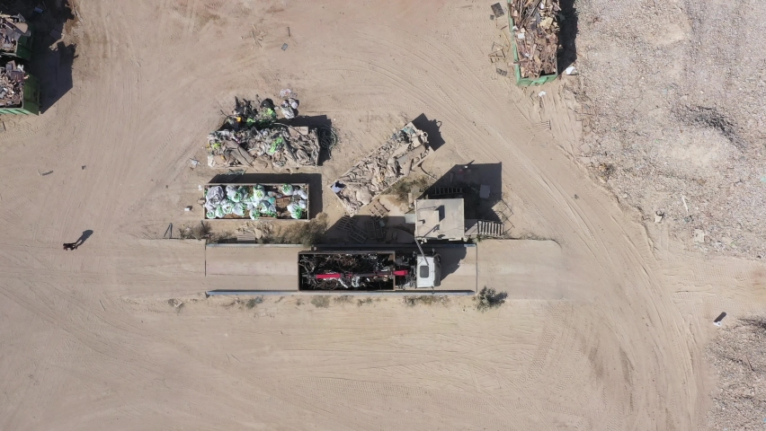 Loaded Truck approaching a weigh station with a full load of scrap metals, Aerial view. Royalty-Free Stock Footage #1063870303