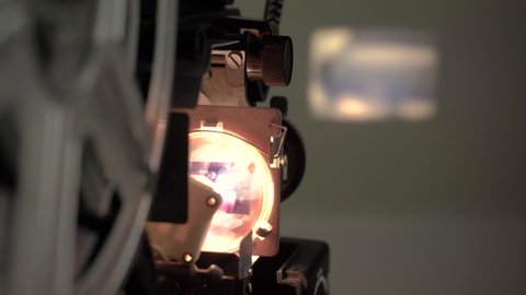 Super 8 cine film projector in operation. lamp detail with blurred background