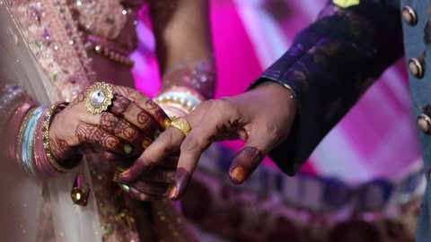 Varanasi,Uttar Pradesh,India-October 25 2020: Footage of an indian marriage party with selective focus.Beautiful bride and groom are exchanging their rings during their marriage. Marriage during covid