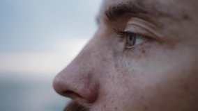 male look, a young man with a beard opens his eyes, gray eyes, looks straight and closes his eyes, on a blurred background, close-up, slow-motion - Powered by Shutterstock - Get 15% off with code: PIKWIZARD15