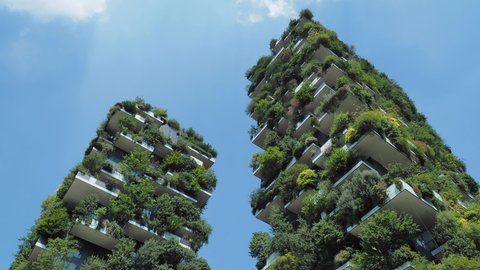 Milano, Italy. December 5, 2020. Bosco Verticale, view at the modern and ecological skyscraper with many trees on each balcony. Modern architecture, vertical gardens, terraces with plants