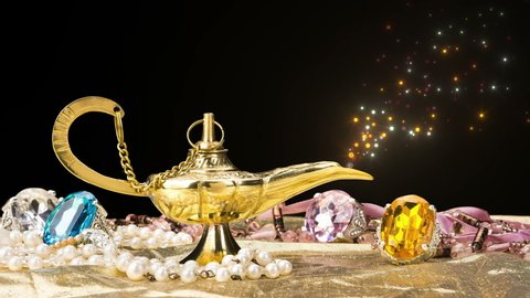 The formation of a magical deity from a gold, magic lamp surrounded by a wealth of jewelry and fantasy isolated on black