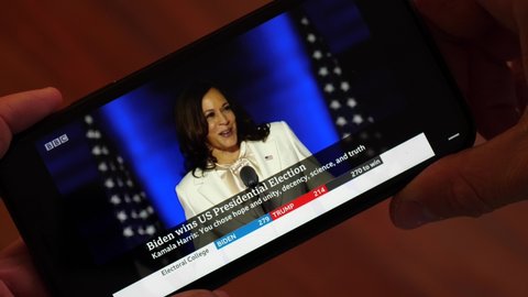 Wilmington, Delaware, USA - 8 November 2020: Kamala Harris First Speech as Vice President-Elect. Watching the Video on a Smartphone