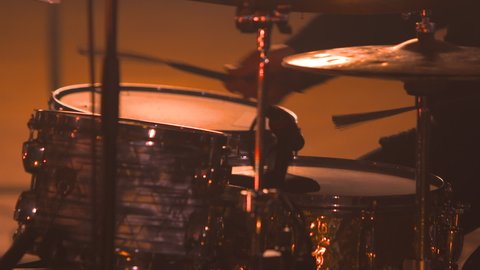Jazz drummer using drum brushes on cymbals and snare close up quick rhythm