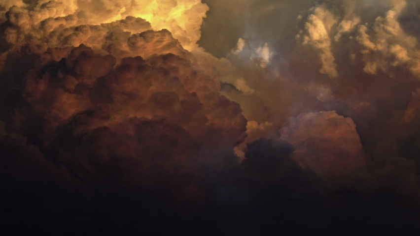 A thunderstorm inside a sunset or sunrise cloud moves with its lightning strike