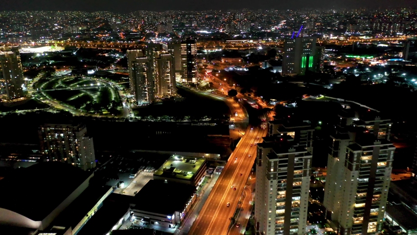 Night city avenue landscape. Metropolitan capital city. Panorama view of city scenery. Metropolis avenue landscaping. Cityscape avenue aerial view. Night Industrial urban district. Sao Paulo, Brazil.