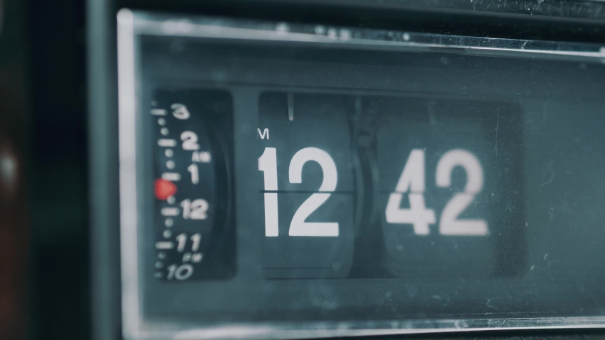 Vintage retro flip clock with the time advancing at a very fast pace showing how time passes fast. Old-style radio analog clock. Royalty-Free Stock Footage #1063929127
