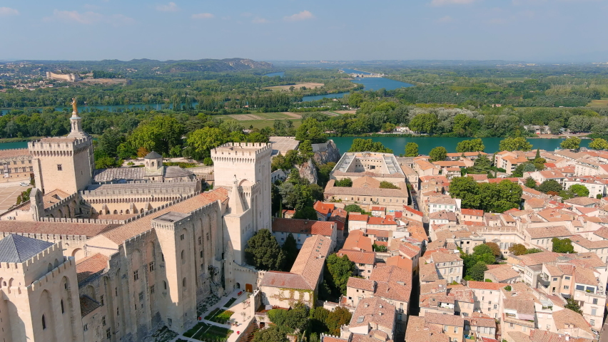 Avignon, France: Aerial view of Palais des Papes (Papal Palace), medieval fortress and former residence of popes in historic city center - landscape panorama of Europe from above
