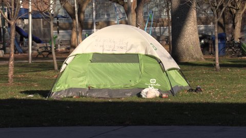 Toronto, Ontario, Canada December 2020 Desperate homeless people sleep in Toronto city park in COVID 19 pandemic recession