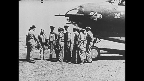 1940s: Pilots, soldiers shake hands in front of airplane. Boats in water. Soldiers storm from boats to shore. Soldiers storm beach. Sign for Dunkirk.