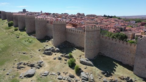 Aerial view of imposing stone defensive walls around historic Spanish city of Avila 