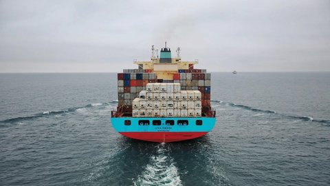 BLACKSEA - CIRCA 2020: Close up of huge cargo ship LEXA MAERSK loaded with many shipping containers underway in Blacksea. Maersk Line is the worlds largest container shipping company. Drone shot
