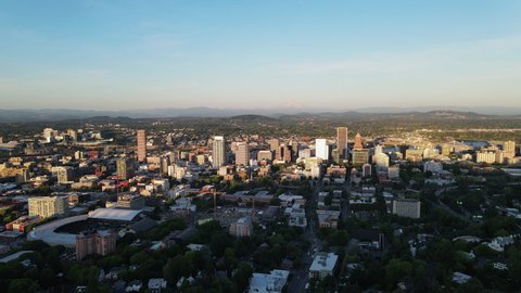 4K Aerial Flyover of Portland Downtown skyline Oregon sunset