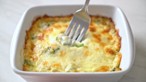 baked spinach lasagna with cheese in white plate