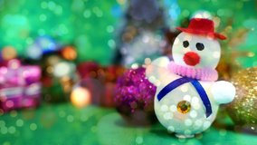 snow man with blurred gift boxes, double exposure with bokeh lights. Zoom in. - Powered by Shutterstock - Get 15% off with code: PIKWIZARD15