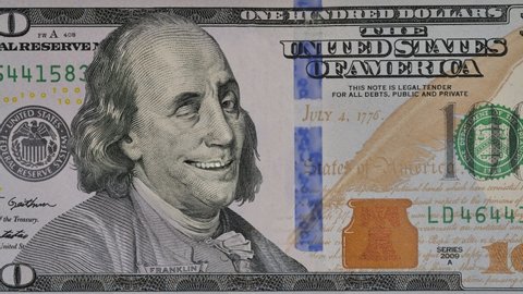 Ben Franklin winks at us from the 100 dollar bill. Funny character animation of the United States money.