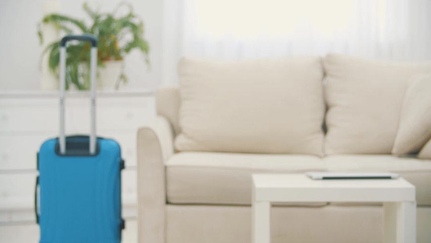 Video of mid adult caucasian manager entering the hotel room and using the lapto during business travel.