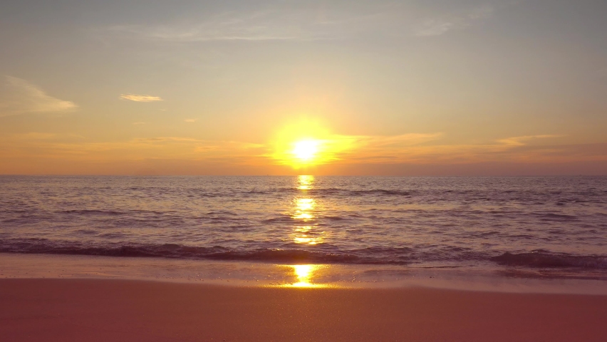 Amazing scene sunset tropical beach sea. New normal after covid-19. Phuket Thailand beautiful tropical beach with a sunset sky. Beautiful Phuket beach is a famous tourist destination in Andaman sea summer. | Shutterstock HD Video #1063970644