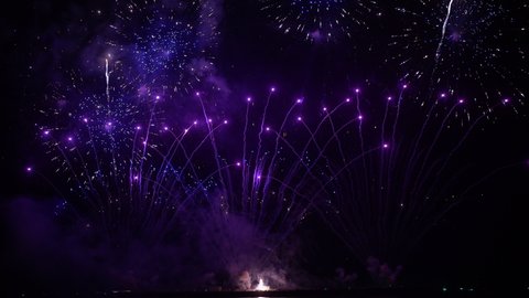 4K Real Fireworks Explosion on Smoke Foggy black Motion Background loop Sky on Fireworks Explosion. Festival Show,Happy New Year.