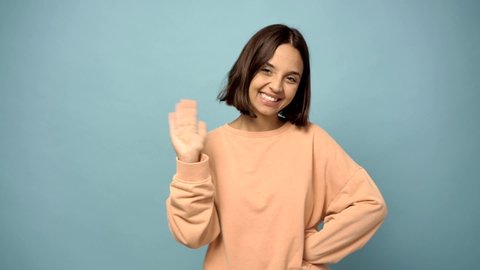 woman saluting with hand with happy expression