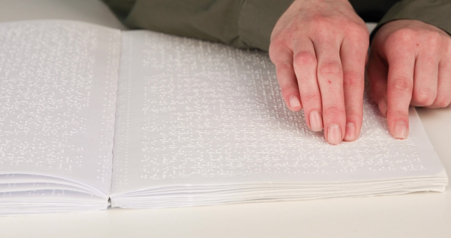 Senior blind man reading a braille book at hospital Videos of People ...