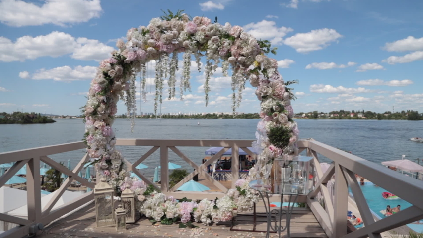  Beautiful wedding arch on the river bank. High quality FullHD footage