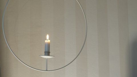 Putting Out Candle with Candle Snuffer, White Copy Space, Close Up.