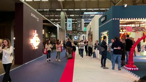 PARIS - CIRCA JANUARY, 2020: Time lapse footage of people walking at Maison Objet fair at exhibition center called "Parc des Expositions de Villepinte" in north of Paris. Camera moves forward.