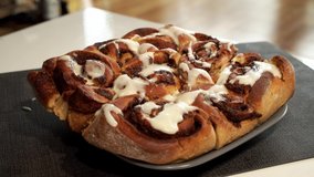 Dripping icing onto Fresh Cinnamon Buns  - Powered by Shutterstock - Get 15% off with code: PIKWIZARD15