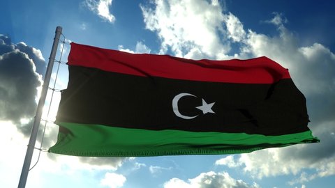 Libya National flag waving in the wind, blue sky background