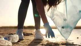 volunteer collecting trash a teamwork. group people on collects garbage plastic trash waste bottles. ecology environmental people teamwork volunteer awareness pollution trash - Powered by Shutterstock - Get 15% off with code: PIKWIZARD15