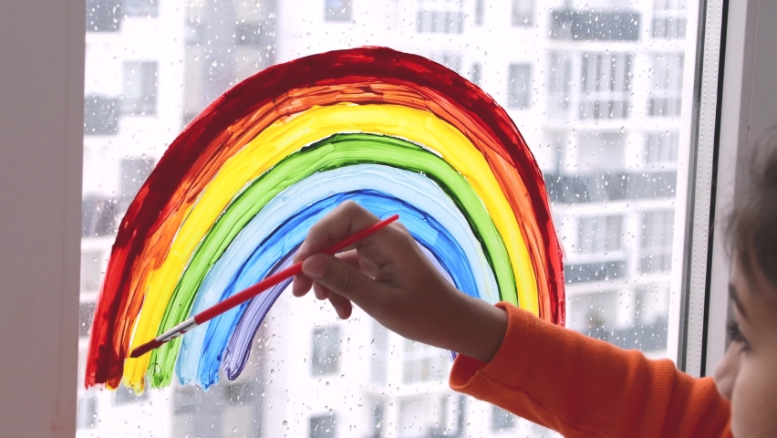 Girl Painting Rainbow On Window During Stock Footage Video (100% ...