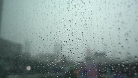 rain drops on window with cold temperature