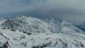 Epic Snow Mountain Landscape Aerial VIdeo 4K. Travel WInter Extreme Weather Hiking Mountaineering And Trekking Concept. Drone Flight Over Snow Mountains Landscape With Pine Forest Cinematic Video.