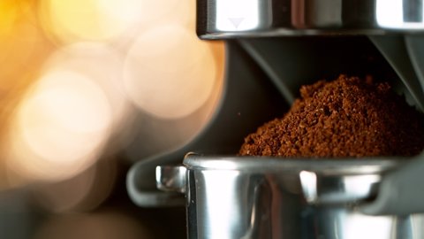 Close-up Slow Motion of Grounding Coffee from Coffee Machine. Filmed on High Speed Cinematic Camera at 1000 fps.