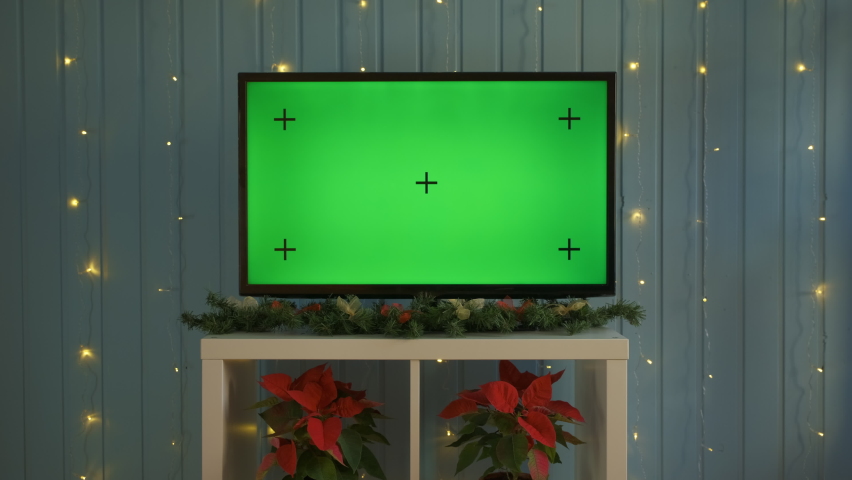Christmas TV with green screen composited. TV or television - green screen - room - on the table. Christmas time