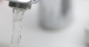 Water flowing from tap in bathroom 4k movie. Plumbing sale concept