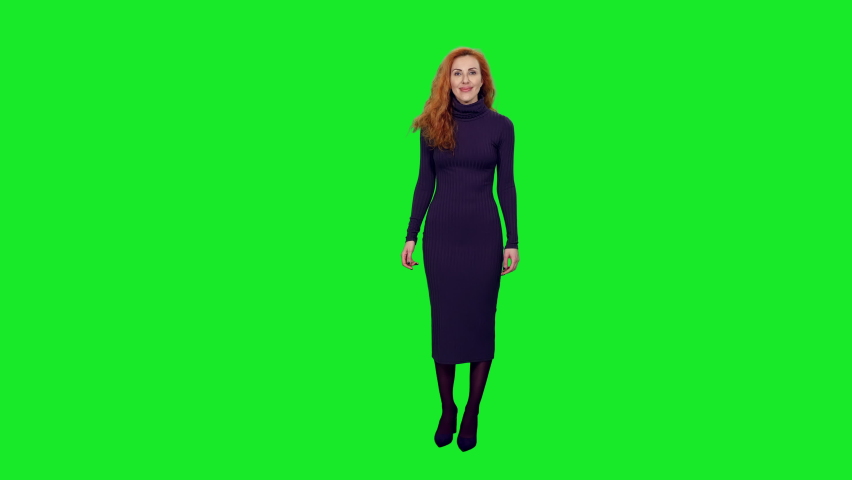 Charming elegant woman with beautiful smile doing presentation and gesturing on green screen background, chroma key 4k pre-keyed footage Royalty-Free Stock Footage #1064051245
